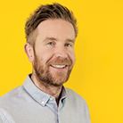 A photo of Simon Wissink, a white man with ginger hair and a ginger beard.
