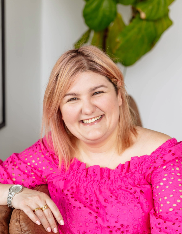 Headshot of Matisse Hamel-Nelis, speaker at Camp Digital. Matisse has bob length blonde hair is wearing a pink top. 