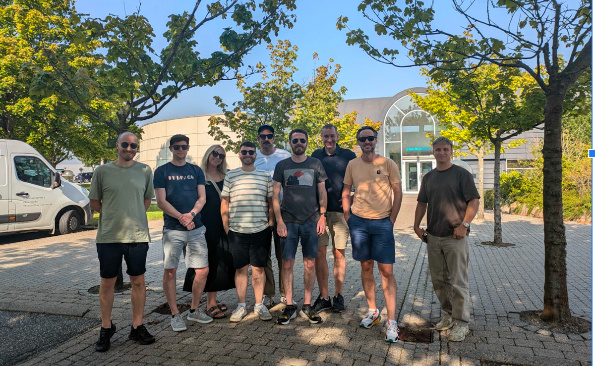 The Umbraco Sustainability Community Team stand in a group smiling