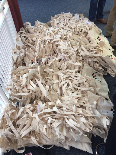 A very large pile of tote canvas bags