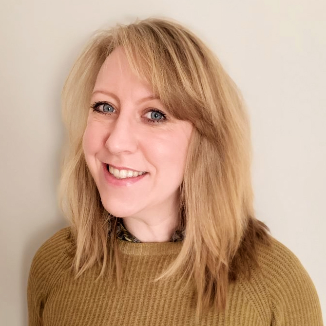 A headshot of Sarah Mace - a smiling white woman with big blue eyes and blonde hair.