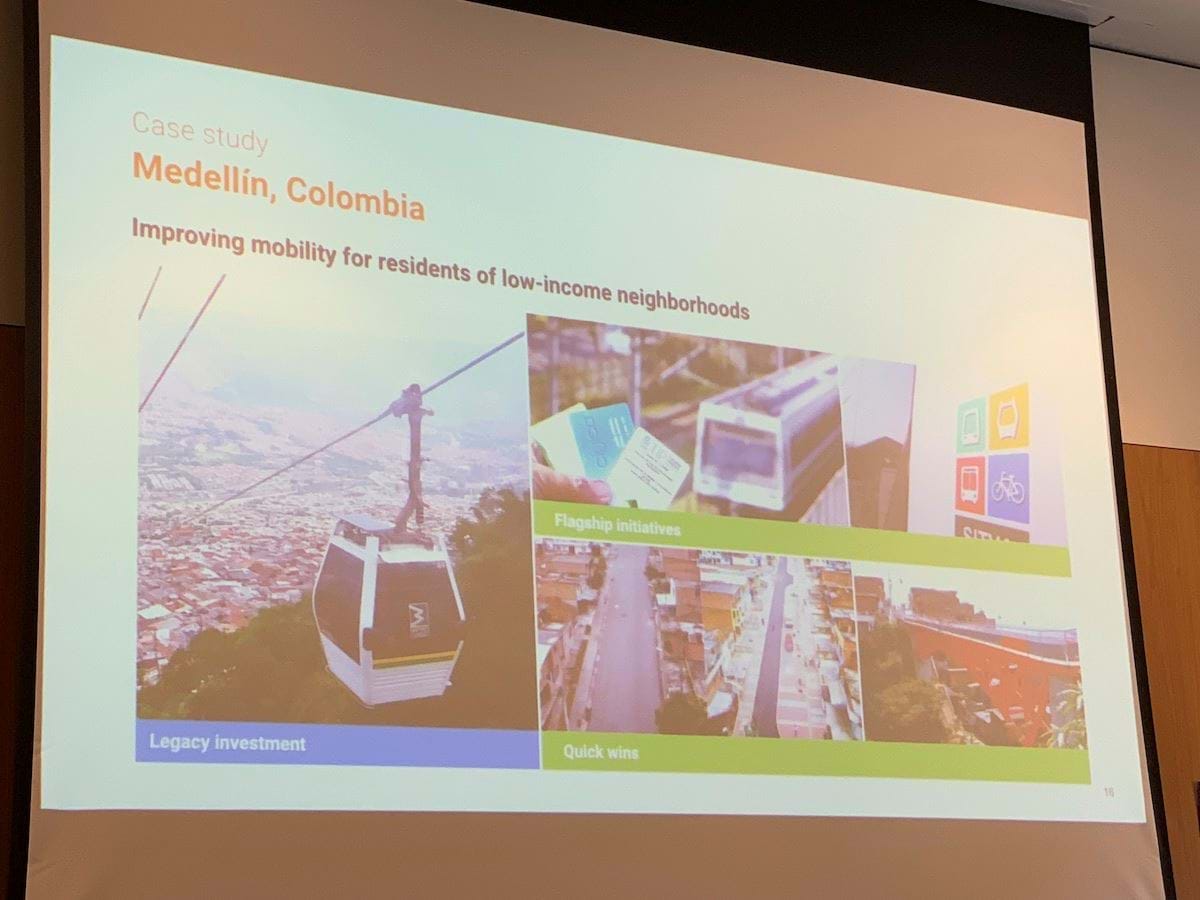 A slide titled 'Case study: Medellin, Columbia. Improving mobility for residents of low-income neighbourhoods. Underneath three images are the words 'Legacy investment', 'Flagship initiatives', 'Quick wins'.