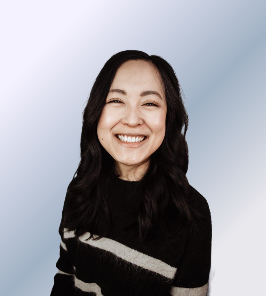 Headshot of Zhen Yang, smiling against a white background