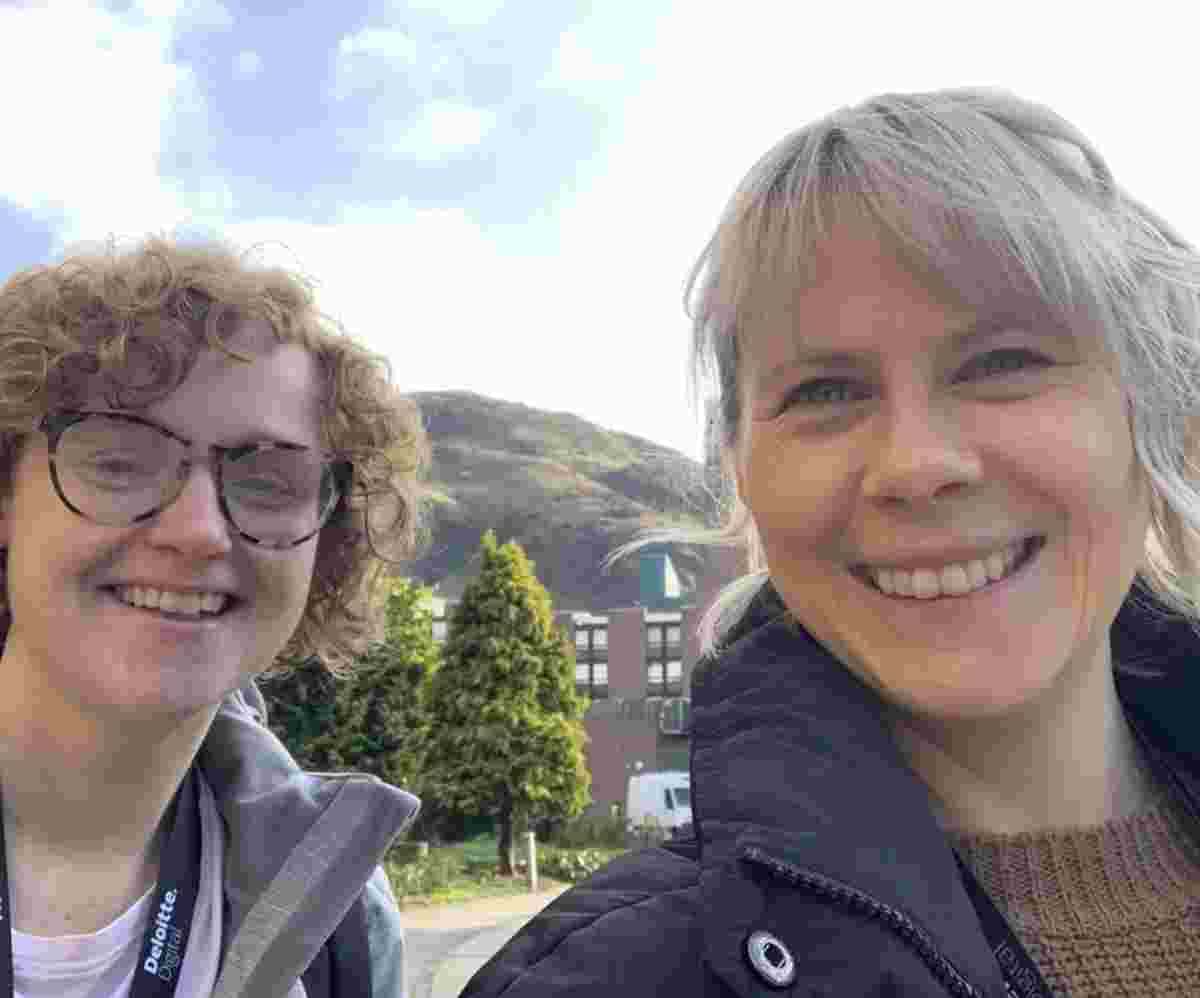 Amy Thornley and Danielle Stone smiling with Arthur's Seat behind them