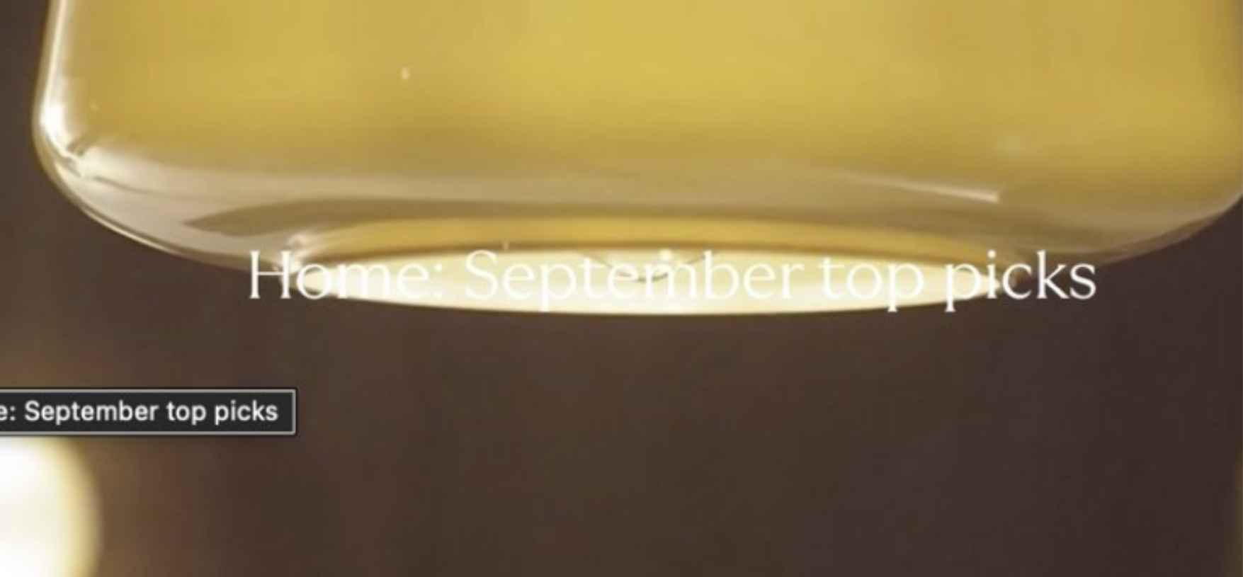Image from an online store, showing a carousel with poor colour contrast between the text and background, making it difficult to read