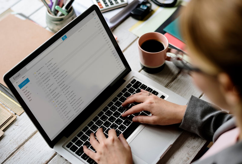 Close up of person working on computer